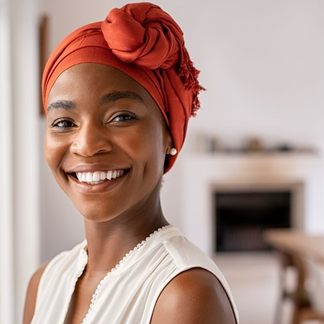 Black Egg Donor In Corral Turban Smiling Image